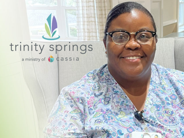 Chanteau Lynette Parris wearing a floral shirt smiling at the camera