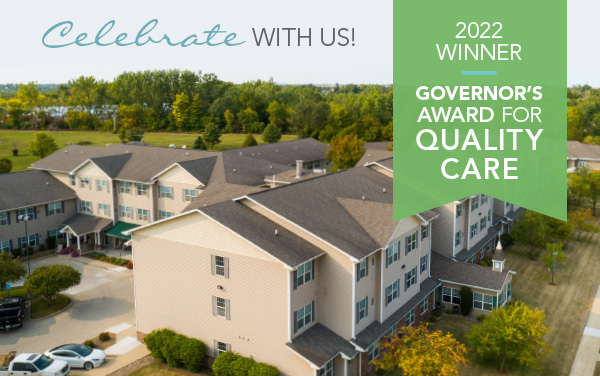 Drone photo of Newton Village with green banner announcing Governor's Award for Quality Care
