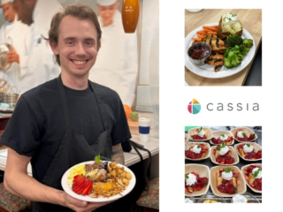 A male cook poses with a plate of food