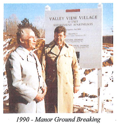 A picture from 1990 of two men posing for The Manor's ground breaking.