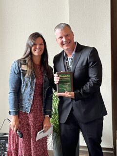 Clive Chamber of Commerce President Emily Bialis presented a plaque to Meadowview of Clive Executive Director Phil Mefford and introduced Clive City Manager Matt McQuillen.