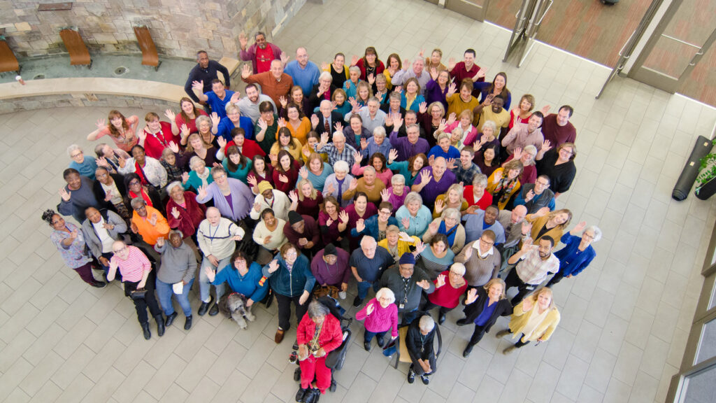 Cassia overhead group shot of diverse residents, participants and staff.