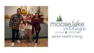 Rose, an international nurse at Moose Lake Village, poses for a picture with her family