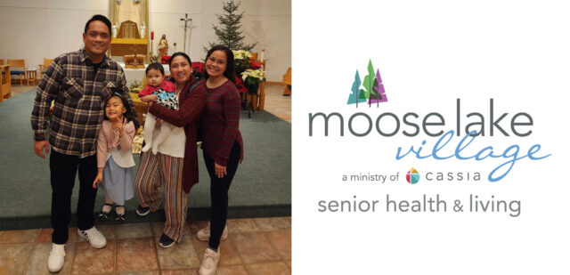 Rose, an international nurse at Moose Lake Village, poses for a picture with her family