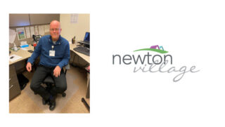Dan Donohue, the new administrator at Newton Village, sits at his desk in a blue sweater, smiling warmly, reflecting his approachable and collaborative leadership style.