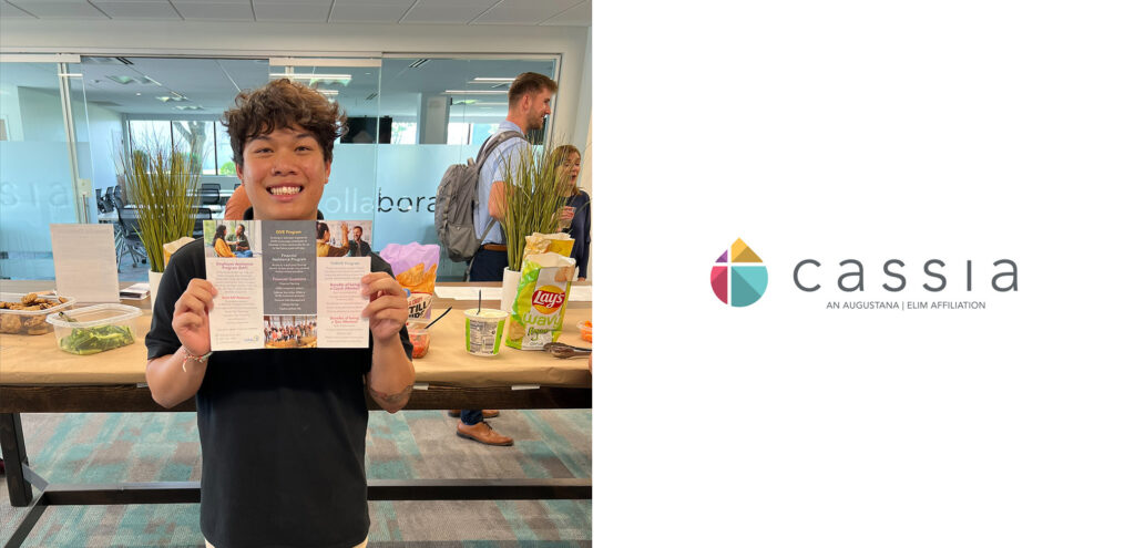 Devon, the Diversity and Inclusion Intern at Cassia, smiles while holding a brochure during his farewell gathering at the Cassia Home Office, surrounded by snacks and drinks. The staff celebrated Devon's impactful contributions to promoting inclusivity within the community as he prepares to head off to school.