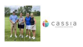 A group of four golfers pose together on the green during the 2024 Cassia Golf Tournament. They are smiling and holding their clubs, dressed in casual golf attire, with trees and a bright green course in the background.