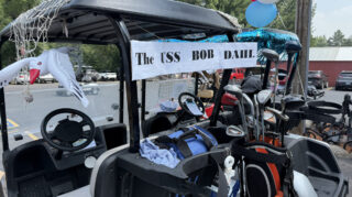 Golf cart decorated as “USS Bob Dahl” for the Milaca Elim Meadows Golf Classic.