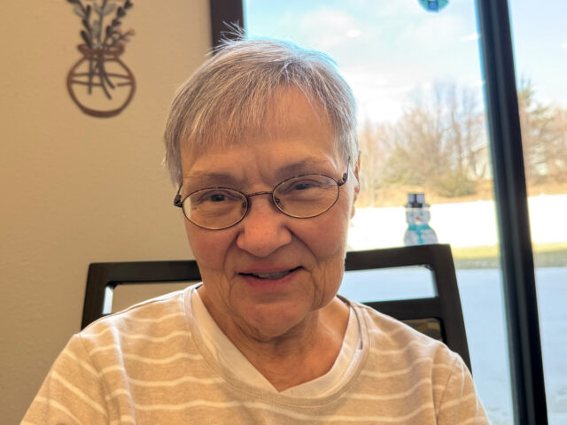 Sandy, a memory care resident at Meadowview of Davenport, loves the chance to connect with others.