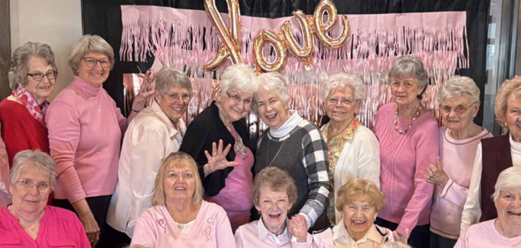 A group of women looking cheerful