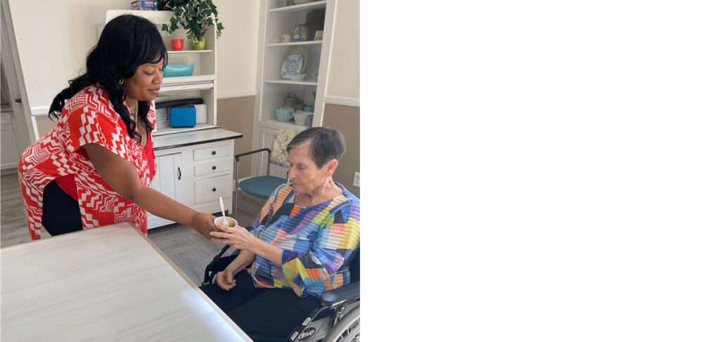 Staff member serves a snack to a memory care resident at Trinity Springs.