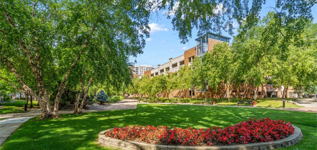 Exterior view of The Pines of Richfield senior living community with landscaped grounds in Richfield, Minnesota