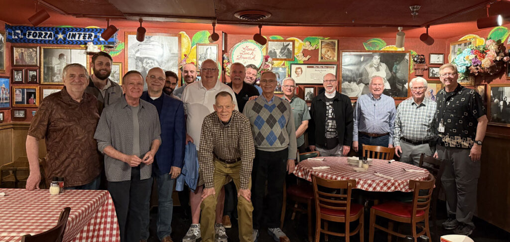 Attendees gathered for a group photo during the EFCA North Central District Conference in a restaurant setting.