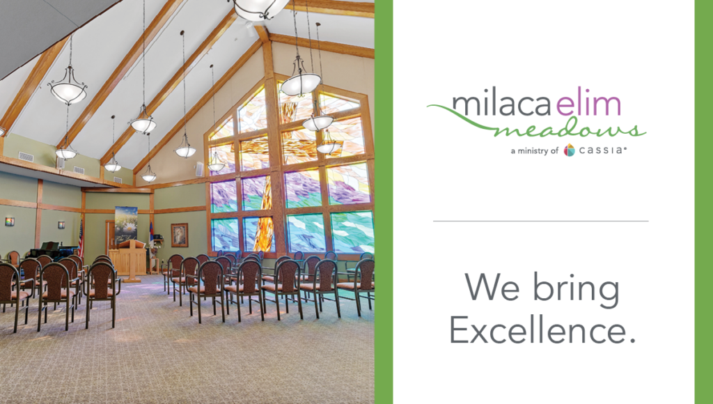 Chapel at Milaca Elim Meadows with stained‑glass cross, seating, and a branded panel reading ‘We bring Excellence’