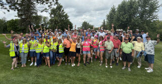 Participants and volunteers gather for a group photo at the 2026 Milaca Elim Meadows Golf Classic at Stones Throw Golf Course.