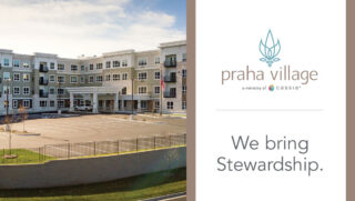 Exterior view of Praha Village senior living community featuring a modern multi-story building, covered entrance, parking lot, and landscaped grounds in New Prague, Minnesota.