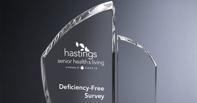 Glass award engraved with the Hastings Senior Health & Living logo and the words “Deficiency-Free Survey.”